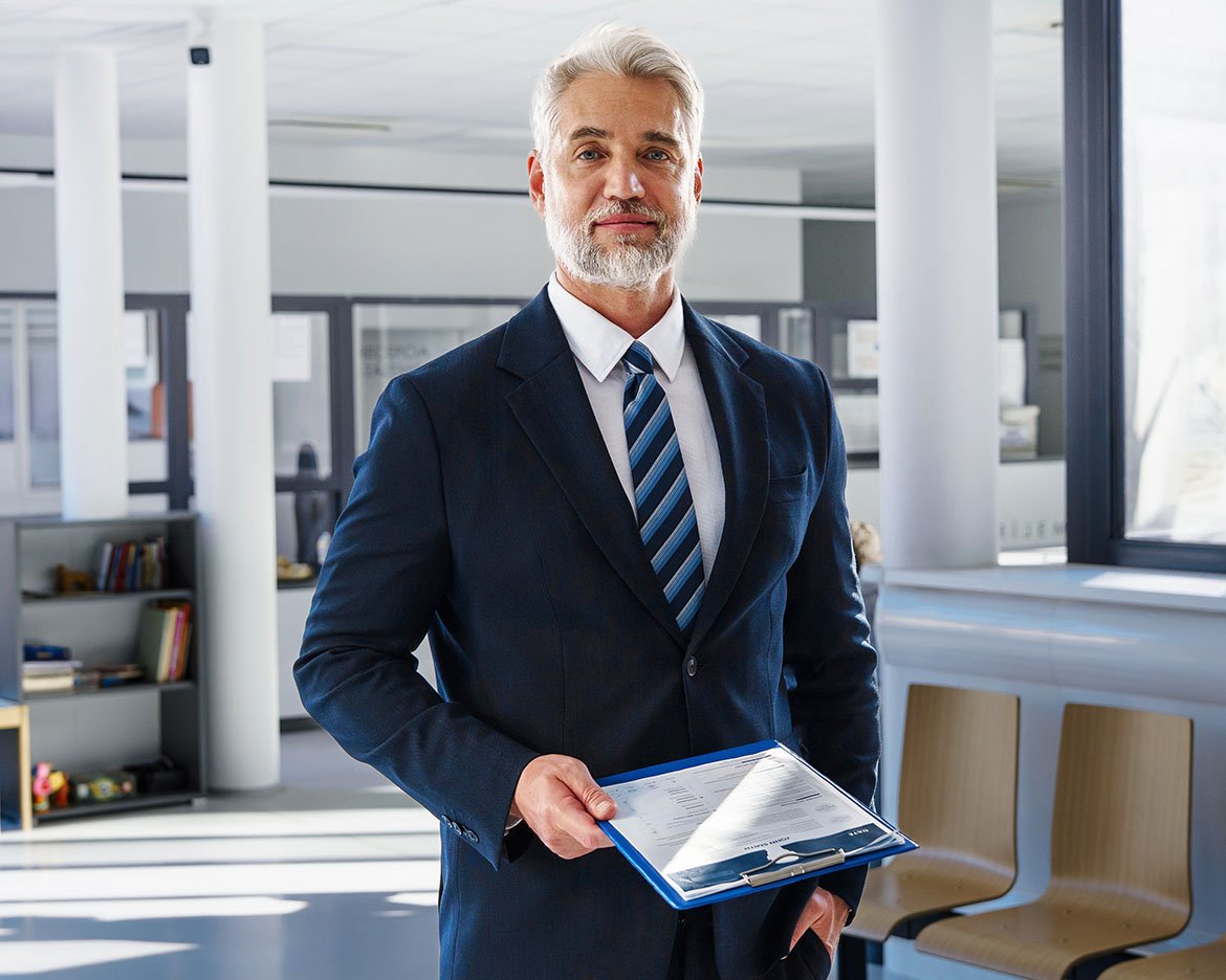 https://talentquestor.com/wp-content/uploads/2026/05/Exec-with-Clipboard.jpg